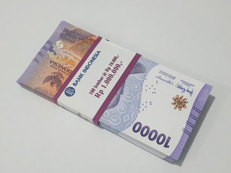 Isolated photo of a wad or a stack or a bundle of ten thousand rupiah bills in new and very good condition. Suitable for giving gifts (THR) during Eid.の写真素材