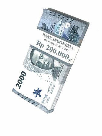 Isolated photo of a wad or a bundle of two thousand rupiah bills in new and very good condition. Suitable for gift for Eid Mubarak.の写真素材