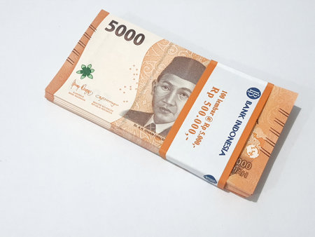 Isolated photo of a wad or a bundle of five thousand rupiah bills in new and very good condition. Suitable for giving gifts (THR) during Eid.の写真素材