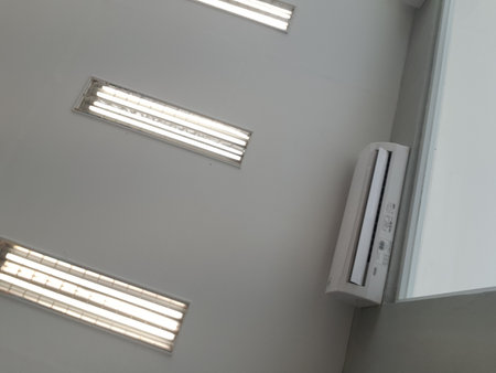 Neon lights that illuminate the room of an office. Lined up so that the room will be very bright when turned on.の写真素材
