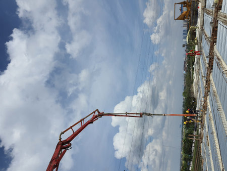 Jakarta, Indonesia on July 5, 2022. This is a process of casting concrete using a concrete pump to reach casting locations that are far away.の写真素材