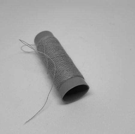 Black and white and Isolated white photo of a sewing thread. With copy space.の写真素材