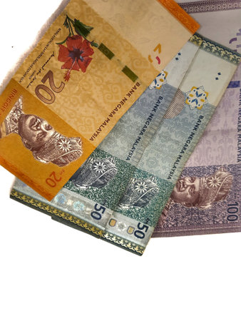 Isolated white photo of some malaysian ringgit banknotes. One 100 note, two 50 notes and one 20 ringgit note.の写真素材