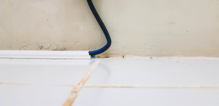 Cable tidy made of plastic serves to make cables neater and less cluttered in the work space.の写真素材