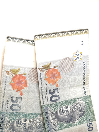 Isolated white photo of two 50 ringgit notes malaysian. Suitable Illustration for malaysian finance or personal finance.の写真素材