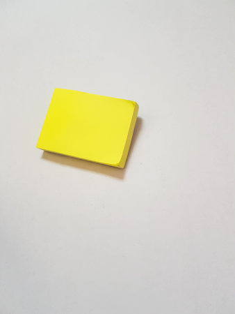 Isolated white photo of a yellow sticky note. These sticky notes look floating. It is suitable for templates to write your short messages or write favorite quotes.の写真素材