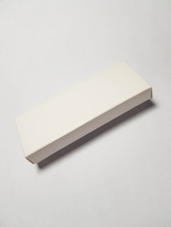 Isolated white photo of a rectangular white packaging box. It is suitable for mock up your packaging products.の写真素材