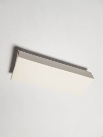 Isolated white photo of a rectangular white packaging box. It is suitable for mock up your packaging products.の写真素材