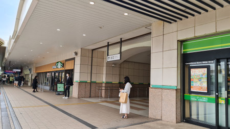 Chiba, Japan on October 5 2023. Maihama JR Station exit gate which will be connected to the Tokyo Disney Resort gateway station resort. There's Starbucks.のeditorial素材