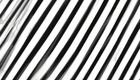Diagonal stripes in black and white create a bold and abstract graphic background, perfect for adding visual interest to designs.の素材