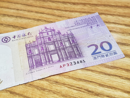 Macau, China on 14 Nov 2024. A close-up reveals a Macau twenty pataca note, showcasing the intricate...