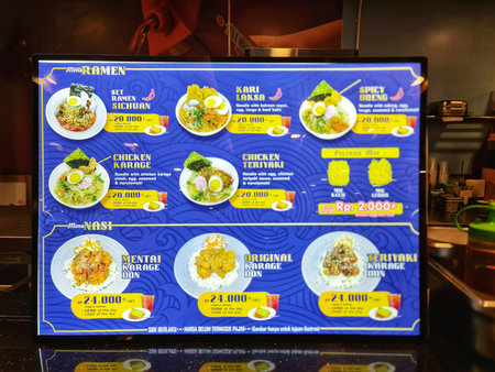 Bekasi, Indonesia on 9 Nov 2025. Menu board displays a variety of ramen and rice bowl options at a restaurant, showcasing different noodle and topping combinations Perfect for restaurant menus and food photography.のeditorial素材