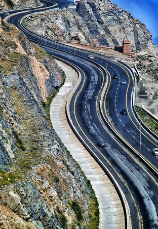 Thaif, Saudi Arabia on 21 February 2024. High-angle view of a winding highway carved into a rugged mountainside.のeditorial素材