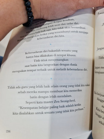 Demak, Indonesia on 27 Jun 2025. Open book displays text focused on self-awareness and personal growth, set in a contemplative mood Perfect for educational or inspirational content.のeditorial素材