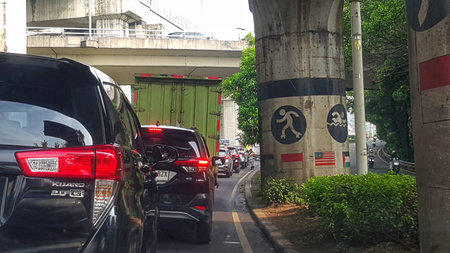 Jakarta, Indonesia on 23 Jun 2025. Dense traffic congestion with cars waiting in a queue on a busy...