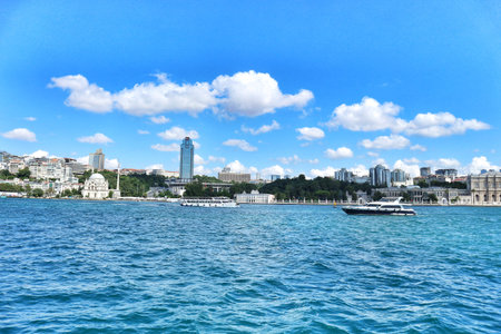 Istanbul, Turkey on 12 July 2022. Bosphorus. A cityscape view across calm water features boats...