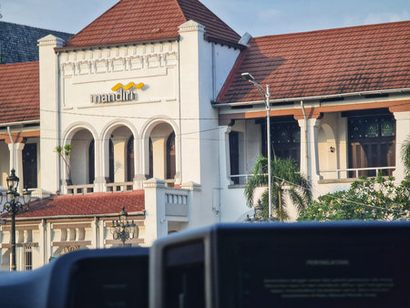 Semarang, Indonesia on 27 Jun 2025. Vintage white building features classic architecture and a red tile roof, set in a warm daylight cityscape evoking a sense of history and urban charm for travel or architectural design concepts.のeditorial素材