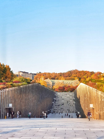 Seoul, South Korea on 12 Nov 2024. Ehwa. Wide stone stairway rises toward a building surrounded by...