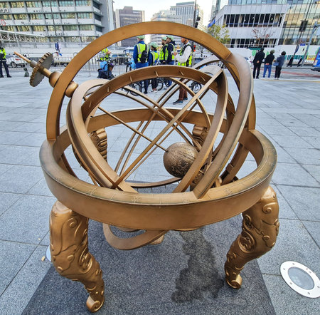 Seoul, South Korea on 11 Nov 2024. An antique golden armillary sphere sits as an ornament in the...