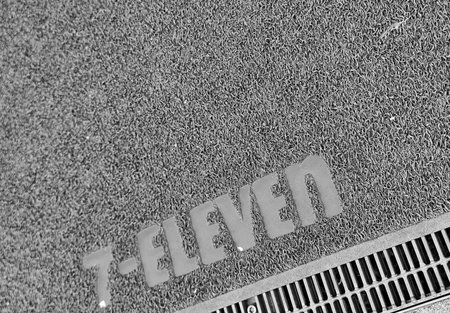 Osaka, Japan on 18 Oct 2025. Textured gray entrance mat shows a gray-toned word inset and sits...