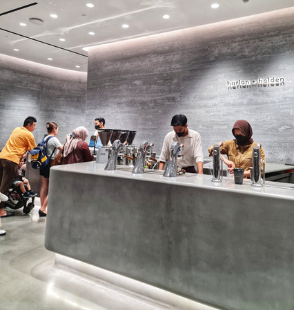 Jakarta, Indonesia on 8 Feb 2025. Two baristas prepare drinks at a modern coffee shop while...