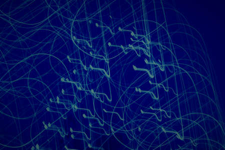 Light streaks with cool blue space backgroundの写真素材