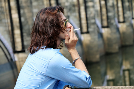 Rough & tough guy male Wear sunglass smokingの写真素材