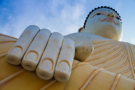 Sitting Buddha against the skyの写真素材