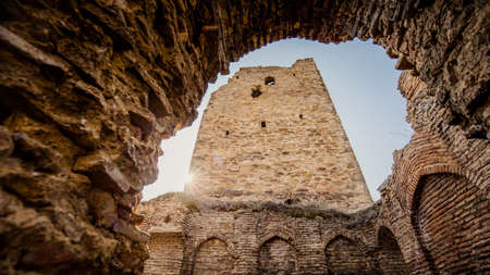 The old tower in the Caucasus at sunset in the sunの写真素材
