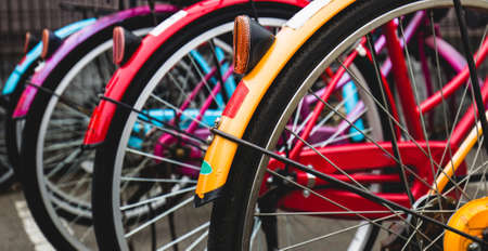 Bicycles of different colors in the parking lotの写真素材