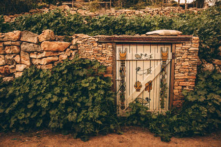 Old doors with a paintingの写真素材