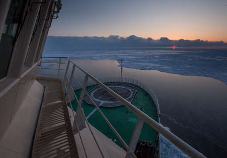 View from the wheelhouse of the Russian icebreaker on the Arctic sunset. Travel across the Kara sea.の写真素材