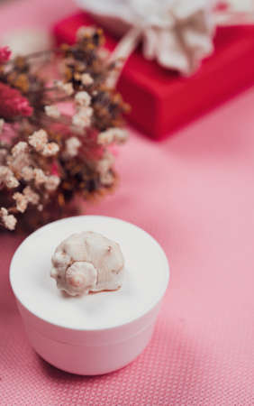A jar of cream on the dressing table on a pink background. Cosmetics set, pastel colorsの写真素材