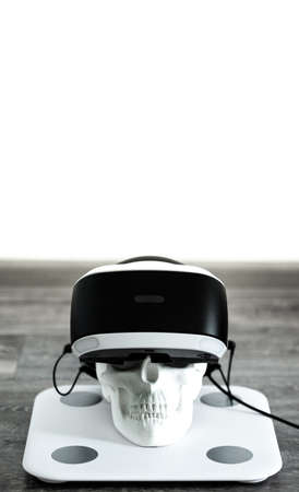 white skull on stand in VR helmet. Digital concept.の写真素材