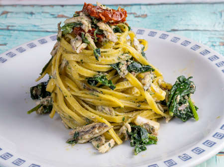 Traditional Italian Mediterranean dish rich in healthy nutrients such as omega 3, antioxidants and vitamins. The dish is prepared by blowing the cooked pasta in a pan with anchovies, black cabbage andの写真素材