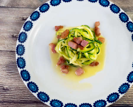 Zucchini alla carbonara with eggs and bacon A twist on the traditional Italian carbonara using zucchini noodles instead of spaghetti and omitting the cream for a gluten free, low carb version of the dの写真素材