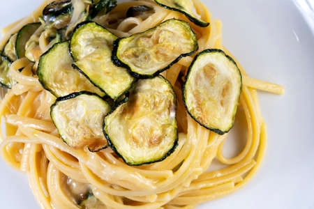 Linguine alla Nerano, typical of Nerano, is a Campania (Italy) dish that will captivate you. Fried zucchini, spaghetti and a typical cheese: Provolone del Monaco!の写真素材