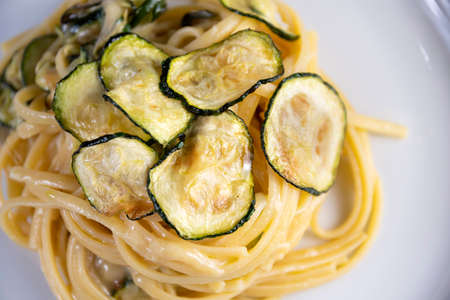 Linguine alla Nerano, typical of Nerano, is a Campania (Italy) dish that will captivate you. Fried zucchini, spaghetti and a typical cheese: Provolone del Monaco!の写真素材