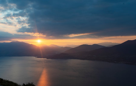 View of Lake Maggiore towards Luino at dawn taken from the viewpoint of Premenoの写真素材
