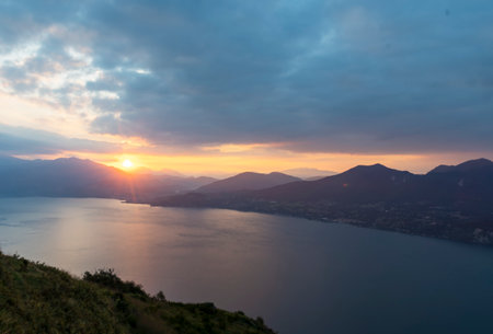 View of Lake Maggiore towards Luino at dawn taken from the viewpoint of Premenoの写真素材