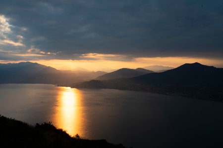 View of Lake Maggiore towards Luino at dawn taken from the viewpoint of Premenoの写真素材