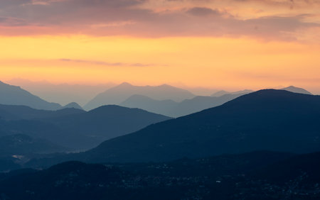 View of Lake Maggiore towards Luino at dawn taken from the viewpoint of Premenoの写真素材