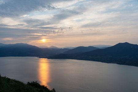 View of Lake Maggiore towards Luino at dawn taken from the viewpoint of Premenoの写真素材