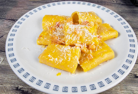 Carbonara paccheri pasta with bacon and eggsの写真素材
