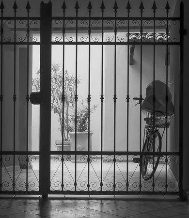 Bike behind a closed gate after shopping.の写真素材