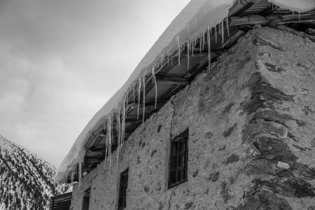 High mountain hut in winter, Valtellina, Italyの写真素材