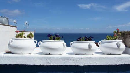 white mediaterranean vessels on a terrace in Sicilyの写真素材