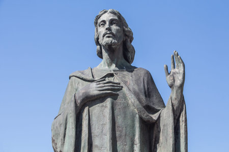 Jesus Christ blessing with a hand over his heartの写真素材