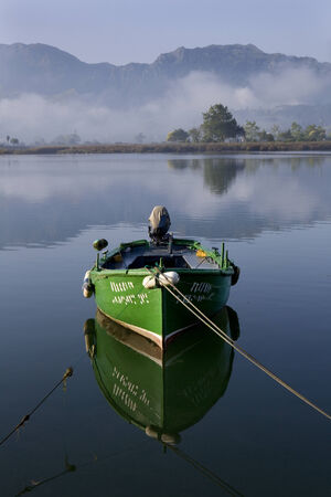 Small fishing boats moored in calm water at Ribadesella, Asturias, North Spain, Europe.の写真素材