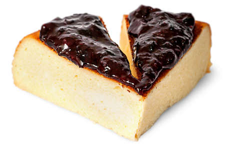 Two pieces of cheese casseroles with currant jam isolated on white backgroundの写真素材